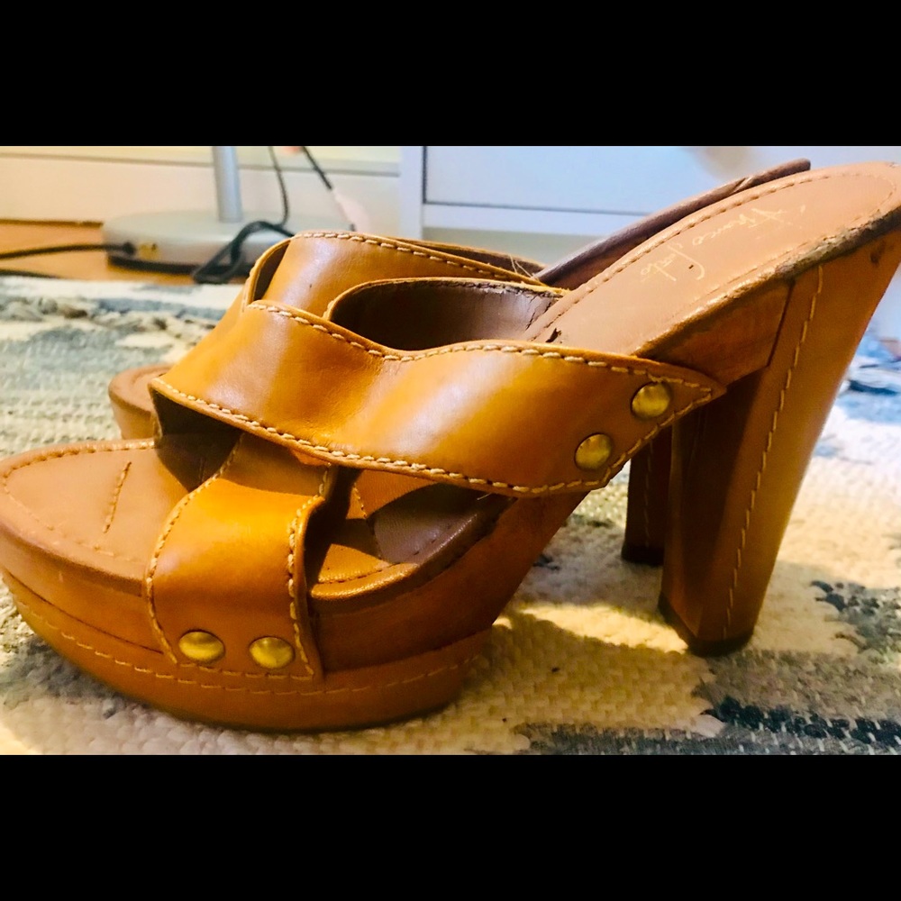 Franco Sarto yellow high heeled clogs.